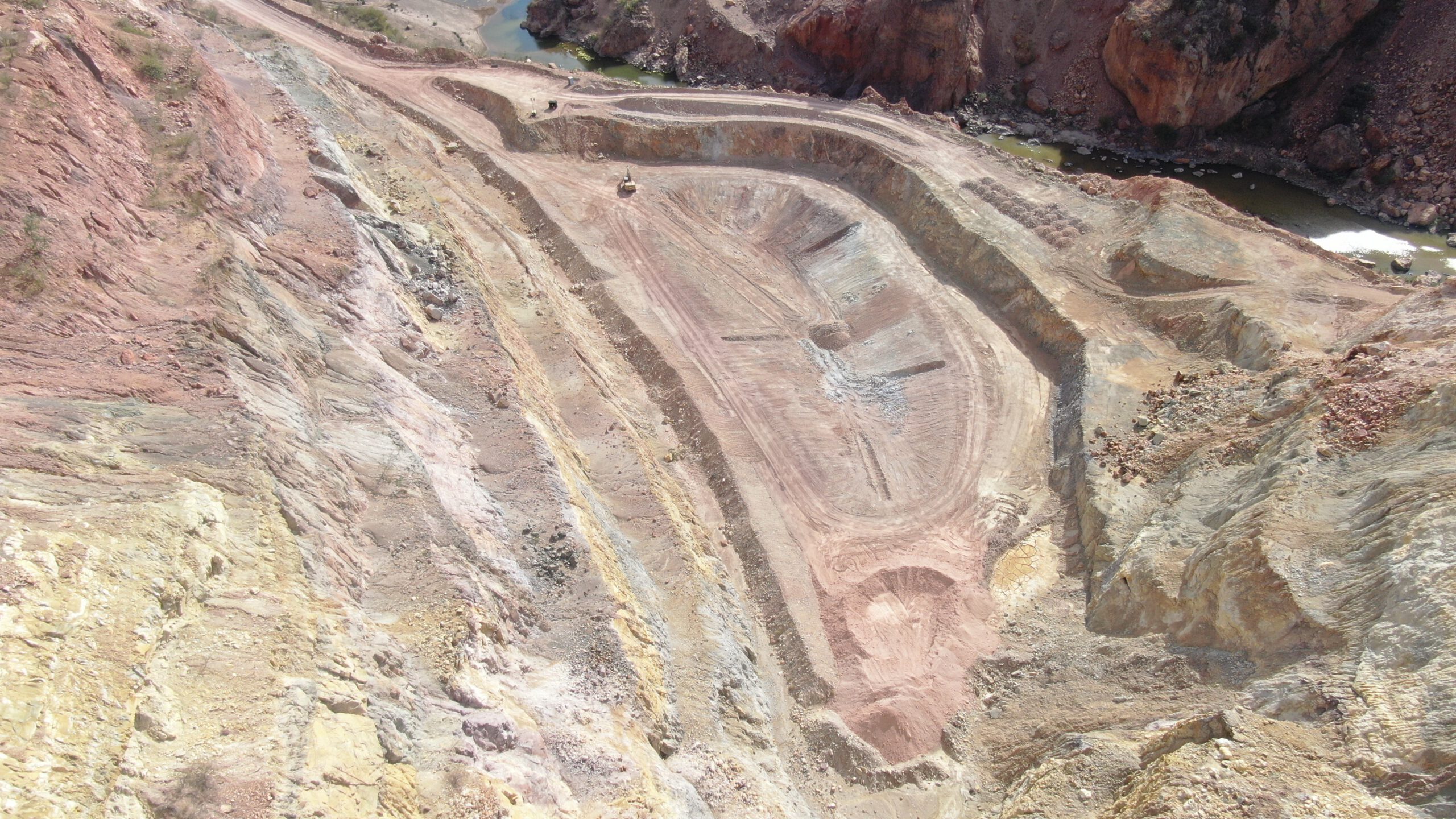 Shaping acid-water collection pond at San Carlos